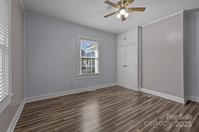 535 5th St, Chester, SC 29706 - unfurnished bedroom featuring crown molding, baseboards, and dark wood-style floors