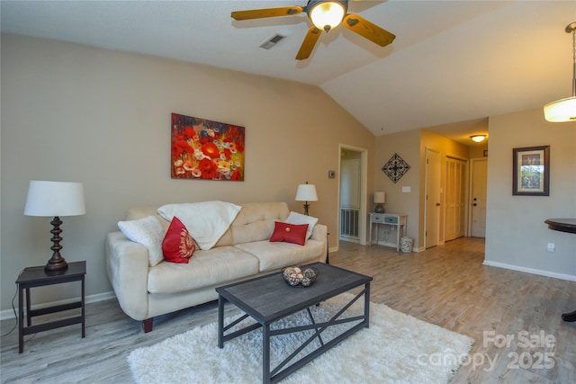 living room with wood-type flooring, ceiling fan, and lofted ceiling