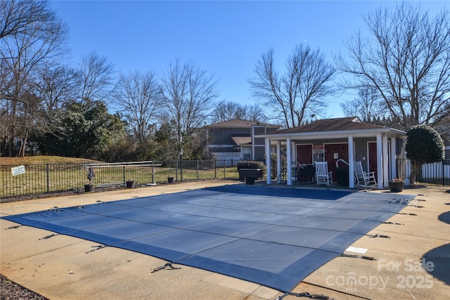 view of pool featuring an outdoor structure and a patio area