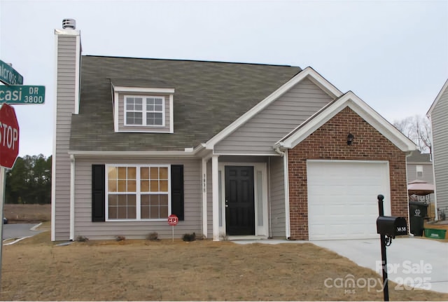 view of front of house featuring a garage and a front yard