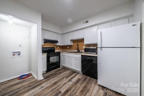 kitchen with sink, white cabinets, decorative backsplash, black appliances, and dark wood-type flooring