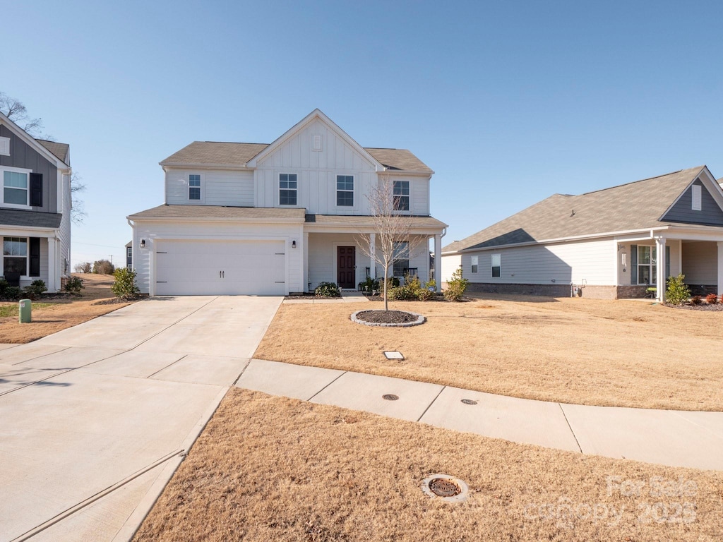 view of front facade featuring a garage and a front lawn