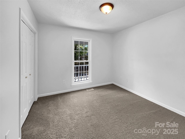 interior space featuring a textured ceiling