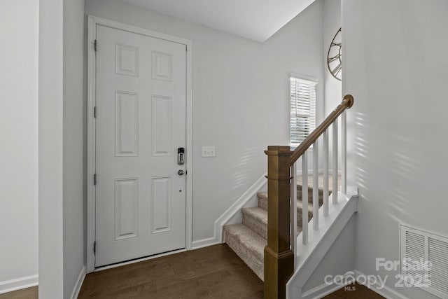 entrance foyer with dark hardwood / wood-style floors