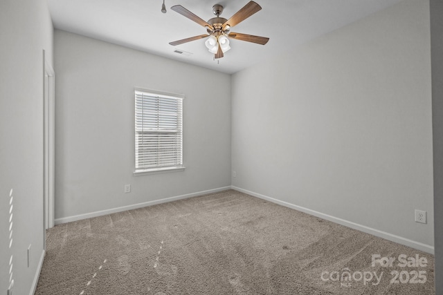 carpeted empty room with ceiling fan