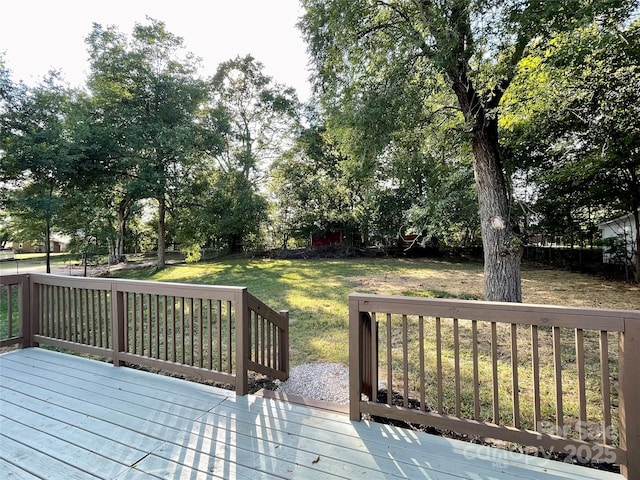 deck featuring a yard