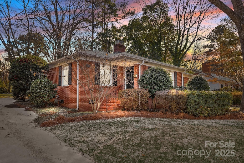 view of property exterior at dusk