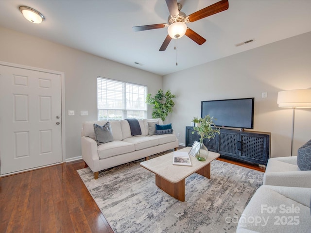 living room featuring hardwood / wood-style flooring and ceiling fan