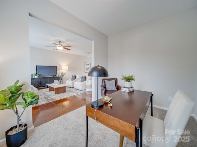 office space with hardwood / wood-style flooring and ceiling fan