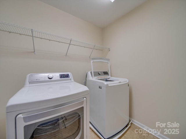 clothes washing area featuring washing machine and dryer