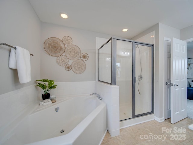 bathroom featuring separate shower and tub and tile patterned flooring