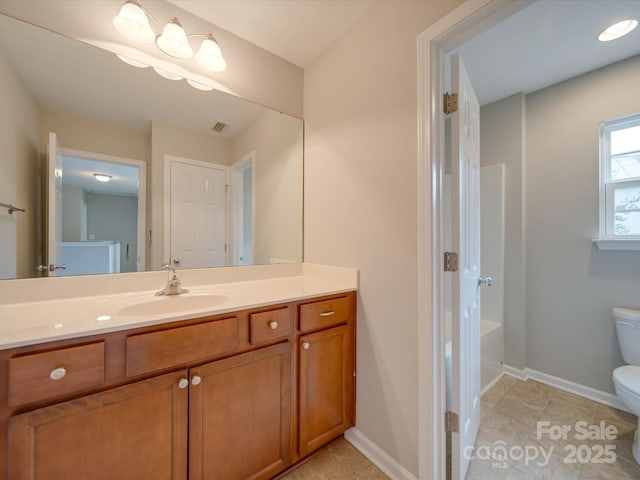 bathroom featuring vanity, toilet, and tile patterned floors