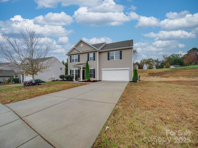 view of front of house featuring a garage and a front yard