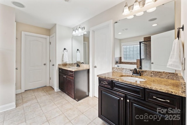 full bathroom with two vanities, tile patterned floors, a sink, a shower stall, and a bath