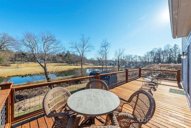 deck featuring a water view