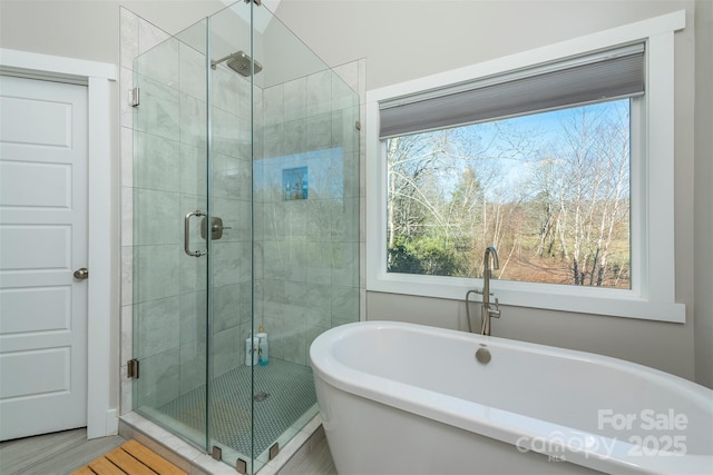 bathroom with shower with separate bathtub