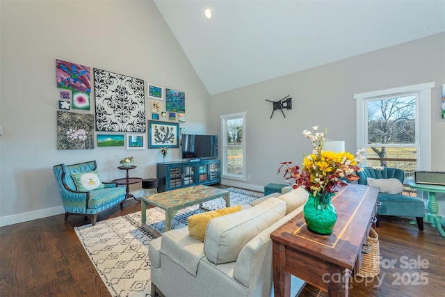 living room featuring a wealth of natural light, high vaulted ceiling, and dark hardwood / wood-style floors