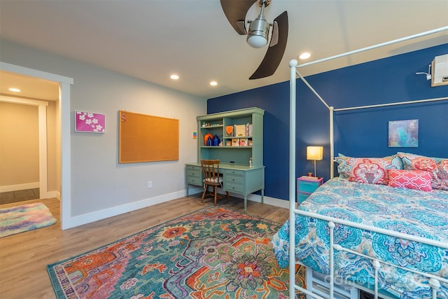 bedroom featuring hardwood / wood-style flooring and ceiling fan