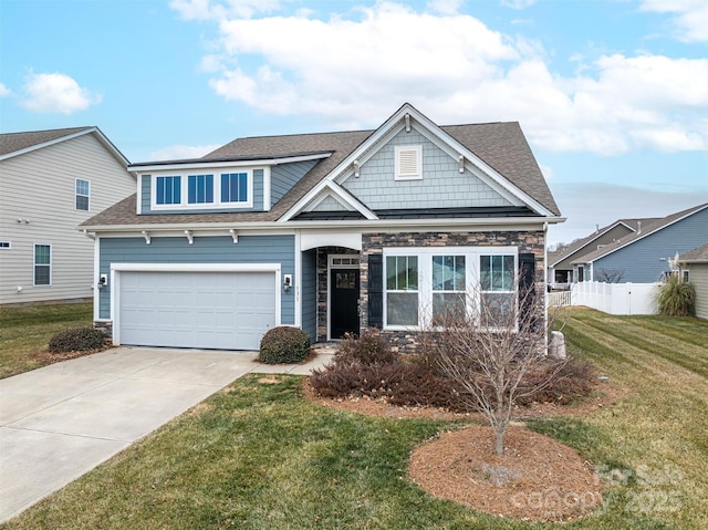 craftsman-style home featuring a garage and a front lawn