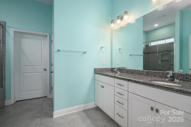 bathroom featuring tile patterned flooring, walk in shower, and vanity