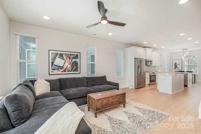 5048 York Park Ln, Charlotte, NC 28217 - living room with visible vents, light wood finished floors, baseboards, ceiling fan, and recessed lighting