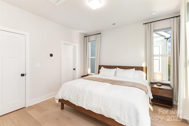 5048 York Park Ln, Charlotte, NC 28217 - bedroom with baseboards, visible vents, and light wood finished floors