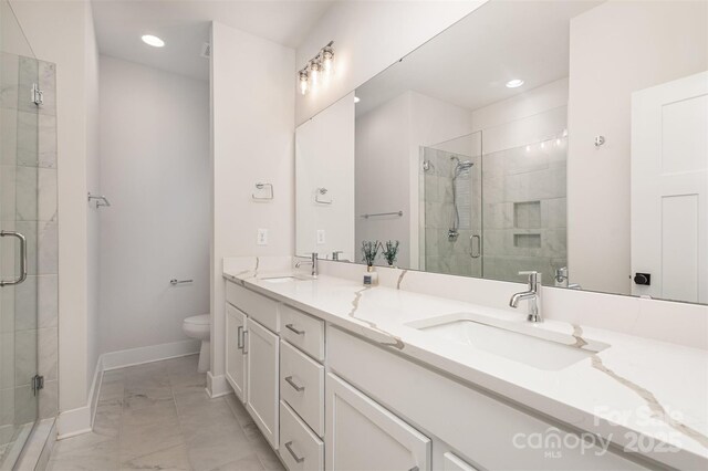 5048 York Park Ln, Charlotte, NC 28217 - full bath with a shower stall, double vanity, toilet, and a sink