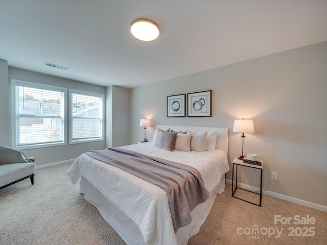 bedroom featuring light carpet