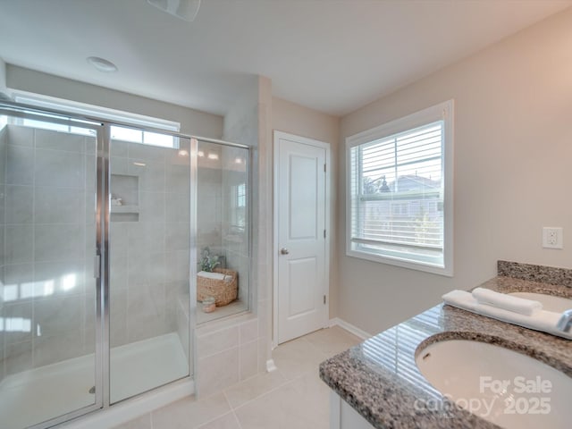 bathroom featuring vanity, an enclosed shower, and tile patterned flooring