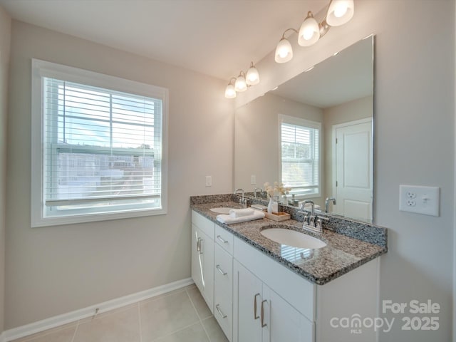 bathroom with vanity and tile patterned flooring