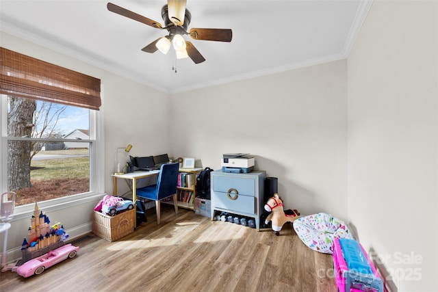 game room with crown molding, hardwood / wood-style floors, and ceiling fan