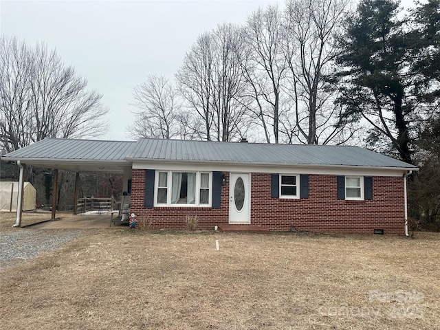 ranch-style home with a carport