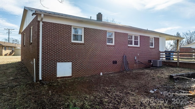 view of side of property with central AC unit