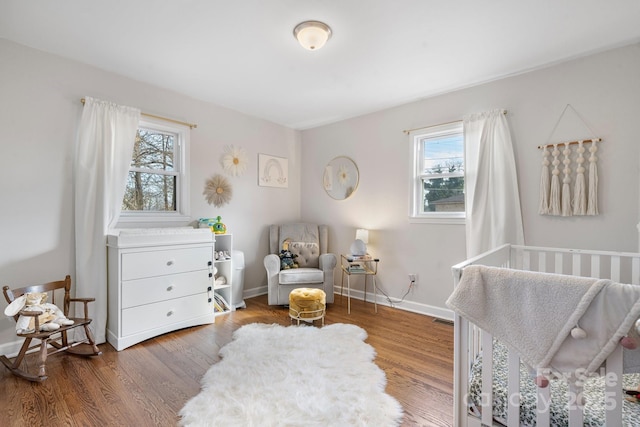 bedroom with hardwood / wood-style flooring