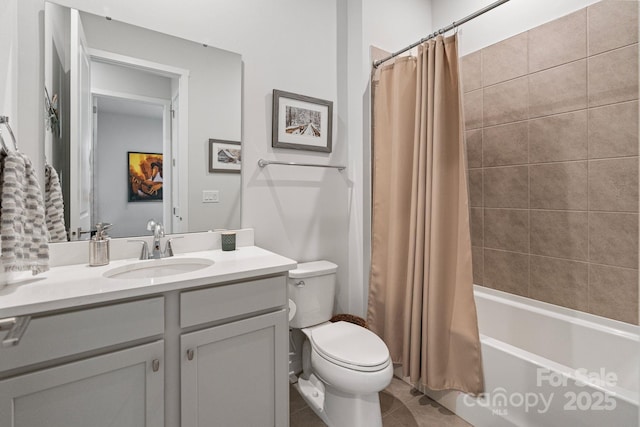 full bathroom featuring toilet, tile patterned floors, vanity, and shower / bath combination with curtain