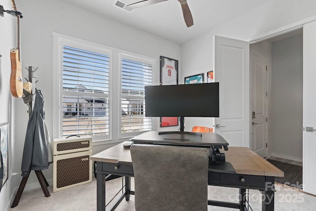 home office featuring heating unit and ceiling fan