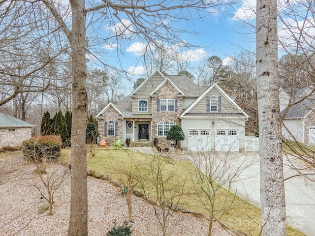 view of front of property with a garage and a front yard