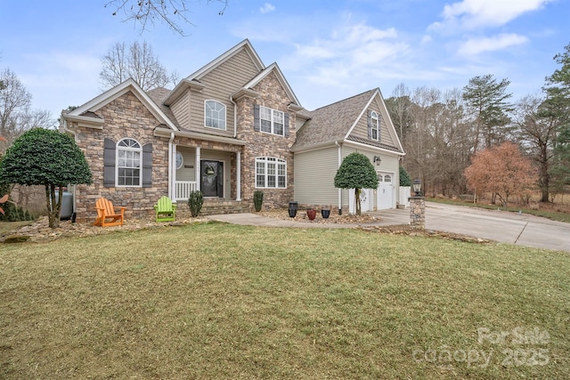 view of front of home featuring a garage and a front yard