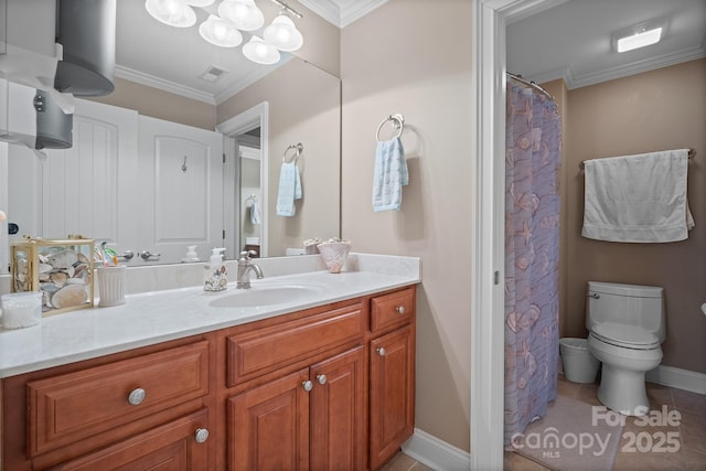 bathroom with vanity, toilet, crown molding, and tile patterned flooring