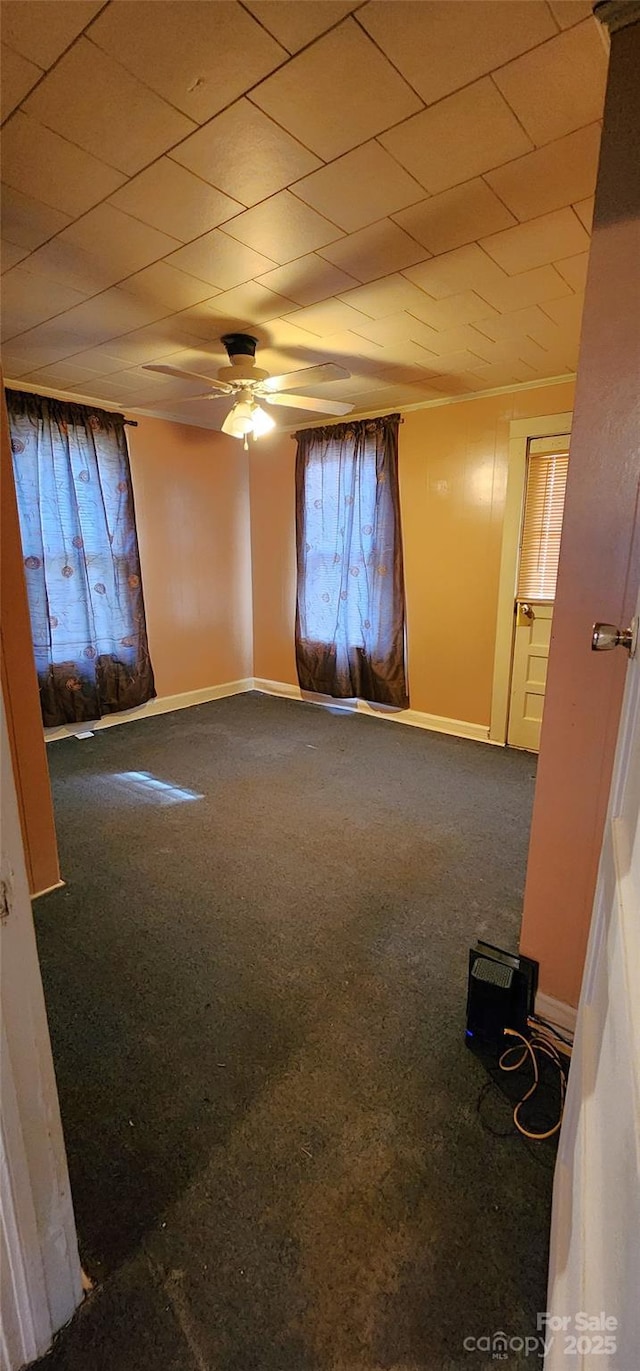 unfurnished room featuring carpet floors and ceiling fan