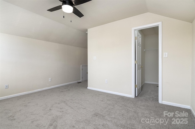 additional living space with ceiling fan, light carpet, and vaulted ceiling