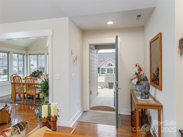 entrance foyer featuring hardwood / wood-style floors and a wealth of natural light