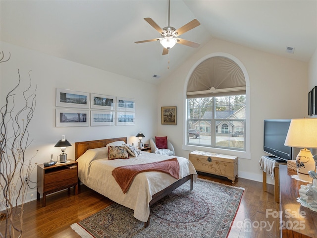 bedroom featuring ceiling fan, hardwood / wood-style floors, and vaulted ceiling