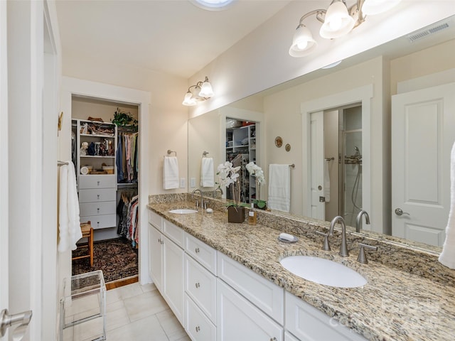 bathroom featuring vanity and tile patterned flooring