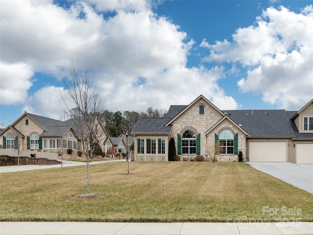 view of front of house featuring a front yard and a garage