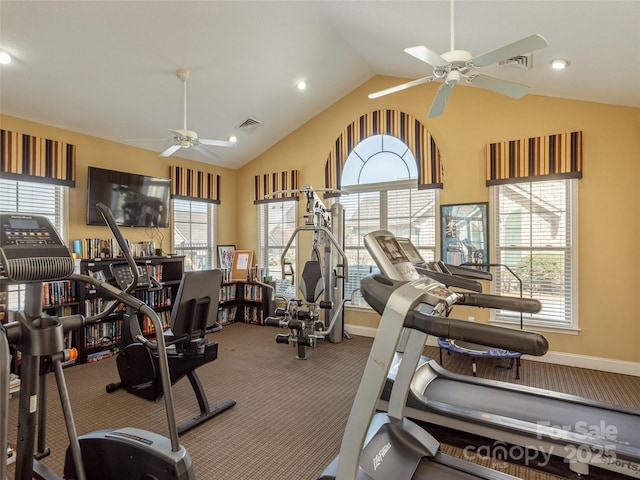 gym with carpet floors, a healthy amount of sunlight, ceiling fan, and vaulted ceiling