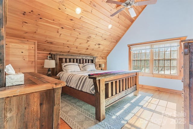 bedroom with wood ceiling, lofted ceiling, and light hardwood / wood-style flooring