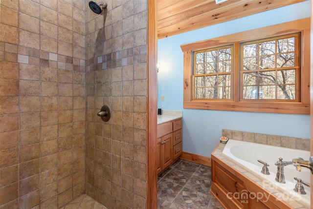 bathroom featuring vanity and shower with separate bathtub