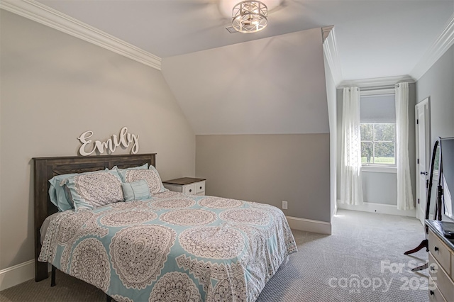 carpeted bedroom with crown molding and lofted ceiling