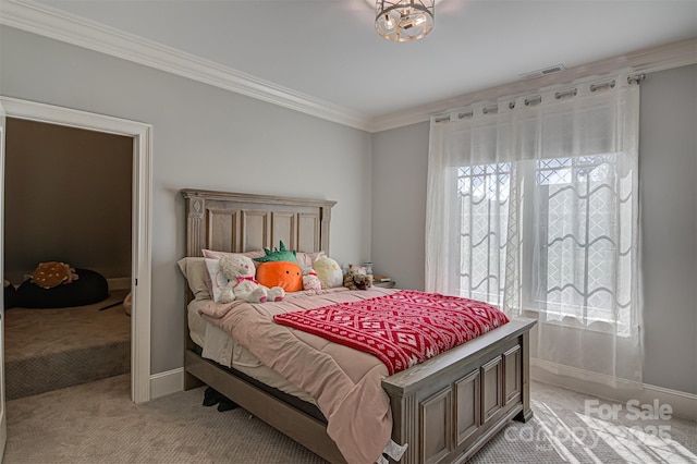 carpeted bedroom with crown molding